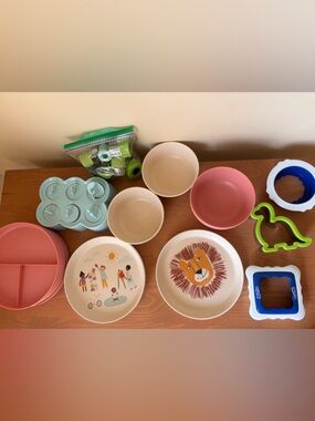 Collection of toddler bowls, plates, sandwich cutters, fruit veg shapers etc